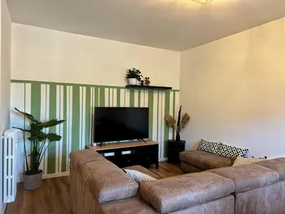 a living room with a couch and a flat screen tv at Appartamento con vista Vaticano in Rome