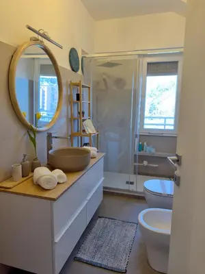 a bathroom with a sink and a toilet and a shower at Appartamento con vista Vaticano in Rome