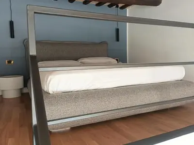 a bunk bed in a room with a mirror at QUIRINALE 56 suite in Rome