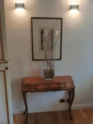 a table with a vase on top of it at QUIRINALE 56 suite in Rome