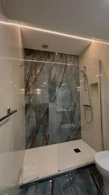 a bathroom with a shower and a sink and a toilet at QUIRINALE 56 suite in Rome