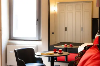 a room with a table and two red cups on it at Amazing Piazza di Spagna in Rome