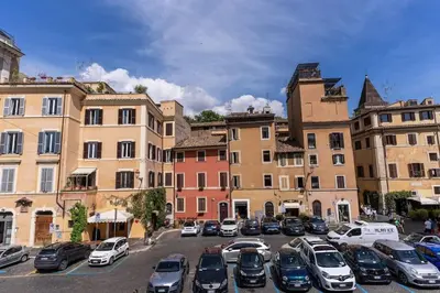 a bunch of cars parked in a parking lot at Trastevere at Piazza Giuditta Arcuati suite in Rome