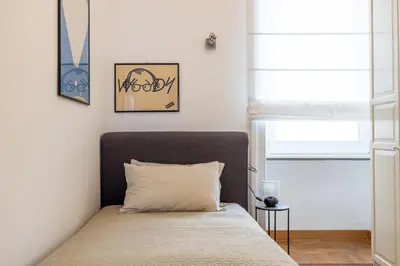 a bedroom with a bed and a window at Adriana Star luxury large and central in Rome