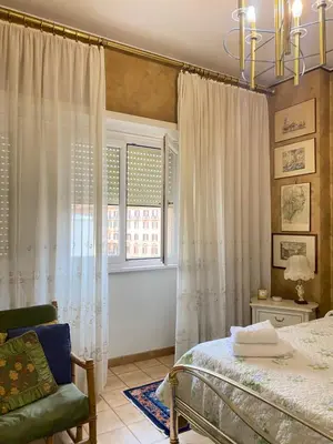 a bedroom with a bed and a window at Room near San Pietro and Vaticano in Rome
