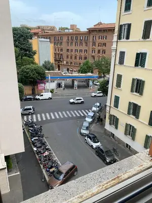 a view of a parking lot with cars in a city at Room near San Pietro and Vaticano in Rome