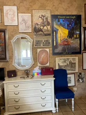 a bathroom with a dresser and a mirror and posters at Room near San Pietro and Vaticano in Rome
