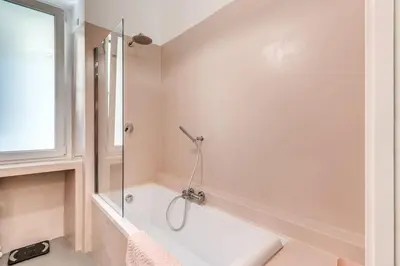a bathroom with a shower and a bath tub at Via Provana San Giovanni 2 bedroom apartment in Rome