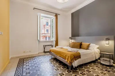 a bedroom with a bed and a window at Trastevere 40 in Rome