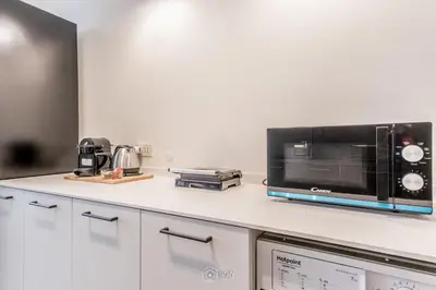 a microwave oven sitting on top of a kitchen counter at Trastevere 40 in Rome
