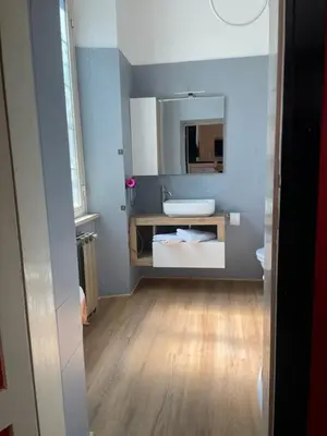a bathroom with a sink and a mirror at La Villa di Roma in Rome