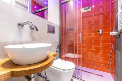 a bathroom with a sink and a shower and a toilet at Dafne room Nido perfetto per coppie a Roma in Rome