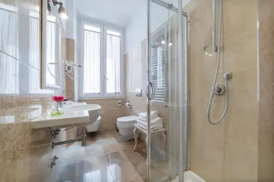 a bathroom with a shower and a sink and a toilet at Le Chiavi di Roma in Rome