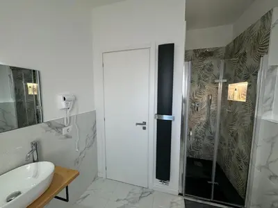 a bathroom with a shower and a sink at Alba White in Rome