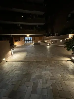 an empty building with a courtyard at night at Alba White in Rome