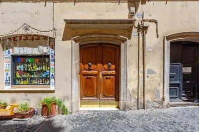 a wooden door on the side of a building at Heavenly Trevi Luxury Apartment in Rome