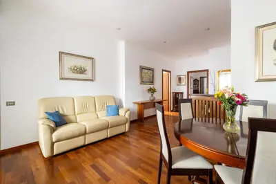 a living room with a couch and a table at Aurelia Dream with Terrace in Rome
