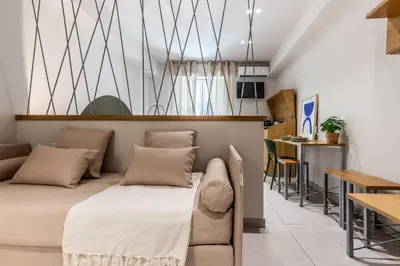 a room with a bed and a table and chairs at Dafne room Speciale, elegante con balcone in Rome