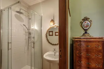 a bathroom with a shower and a sink and a toilet at Daplace - Villetta Sant'Onofrio in Rome