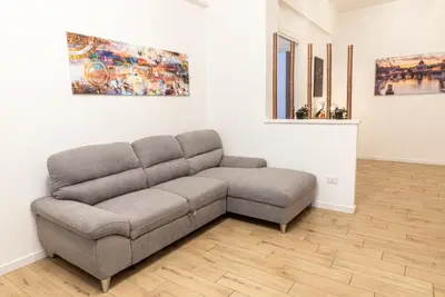 a living room with a couch in a room at Rea house Colli Albani - B&Brother's rome in Rome
