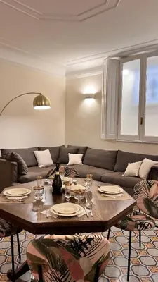 a living room with a table and a couch at 3Bdr Apartment in the heart of Rome in Rome