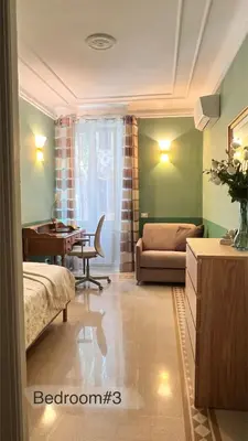a living room with a bed a desk and a couch at 3Bdr Apartment in the heart of Rome in Rome
