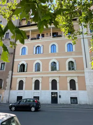 a black car parked in front of a building at 3Bdr Apartment in the heart of Rome in Rome