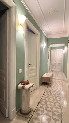 a bathroom with green walls and a toilet in it at 3Bdr Apartment in the heart of Rome in Rome