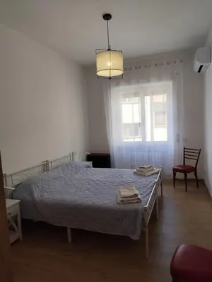 a bedroom with a bed with two towels on it at da Giò a Trastevere in Rome