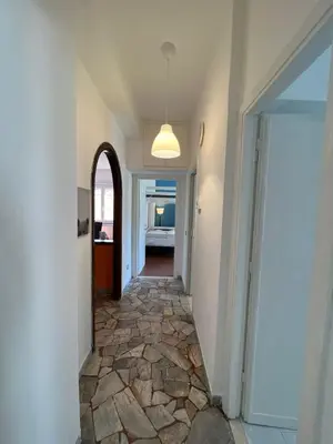 a hallway with a stone floor in a house at Alla Pineta in Rome