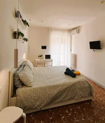 a bedroom with a large bed in a room at Pi gneto GH Locazione Turistica in Rome