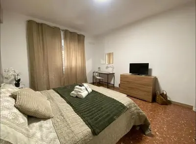a bedroom with a bed and a television in it at Fuffy House Rome in Rome