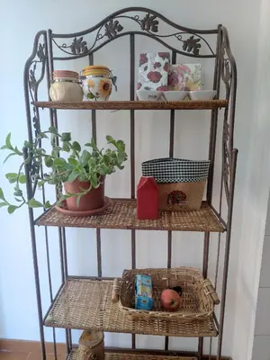 a shelf with a plant and other items on it at Double- Room Basilica San Paolo in Rome
