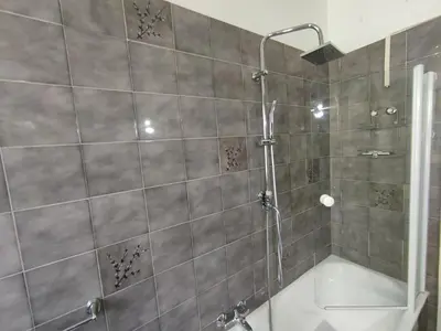 a bathroom with a shower and a bath tub at Double- Room Basilica San Paolo in Rome