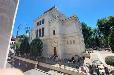 a white building with people walking in front of it at Appartamento 