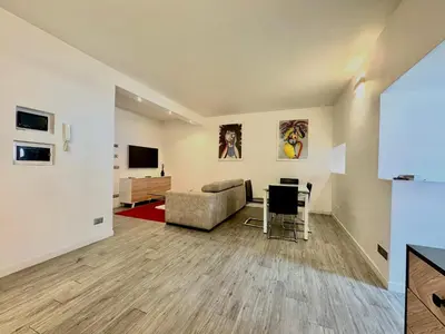 a living room with a couch and a table at Mercede Apartment - Spanish Steps in Rome