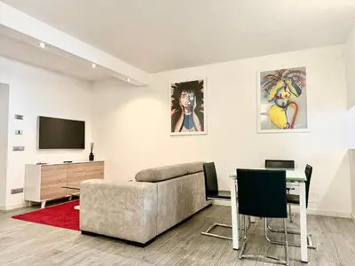 a living room with a couch and a table at Mercede Apartment - Spanish Steps in Rome