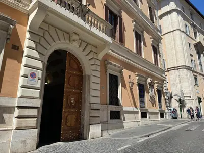 an entrance to a building with a wooden door at Mercede Apartment - Spanish Steps in Rome