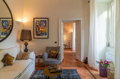 a living room with a couch and a table at Villa Borghese Luxury Place in Rome