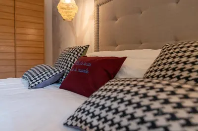 a bedroom with a bed with pillows on it at Villa Borghese Luxury Place in Rome