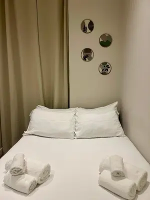 a bed with towels on top of it at D Guest House in Rome