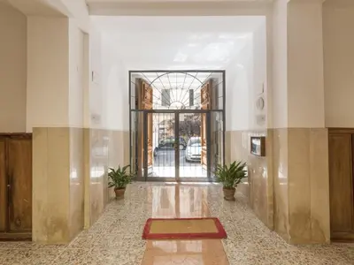 an empty hallway with a door and plants in a building at Apartment Alessandria Home by Interhome in Rome