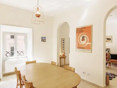 a dining room with a wooden table and chairs at Apartment Alessandria Home by Interhome in Rome