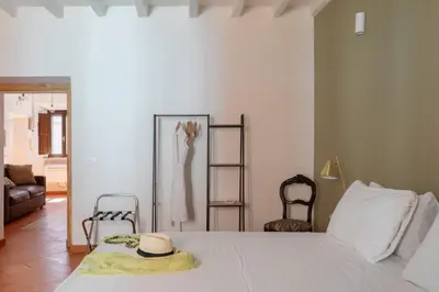 a bedroom with a bed with a hat on it at iFlat Peaceful brand new 2beds apt in Trastevere in Rome