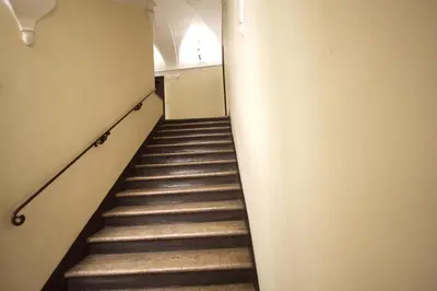 a stairway in a building with a stair case at Navona New Charming Apartment in Rome