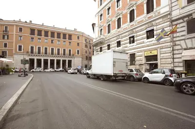 a truck parked on the side of a city street at Navona New Charming Apartment in Rome