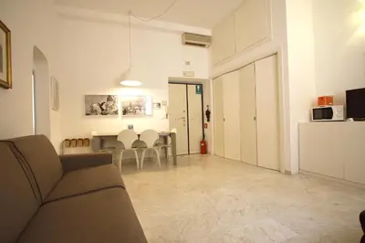 a living room with a couch and a table at Navona New Charming Apartment in Rome