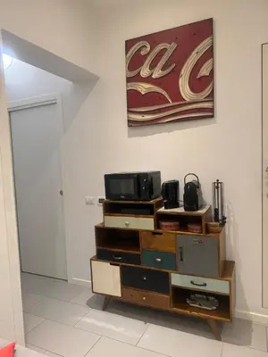 a living room with a tv on a dresser at Casetta 79 in Rome