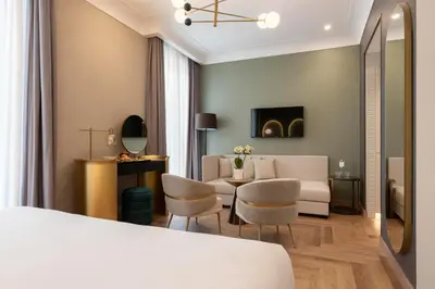 a living room with a couch and a table at Je Rome Hotel in Rome