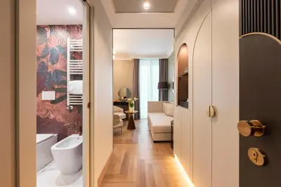 a room with a bathroom with a tub and a toilet at Je Rome Hotel in Rome